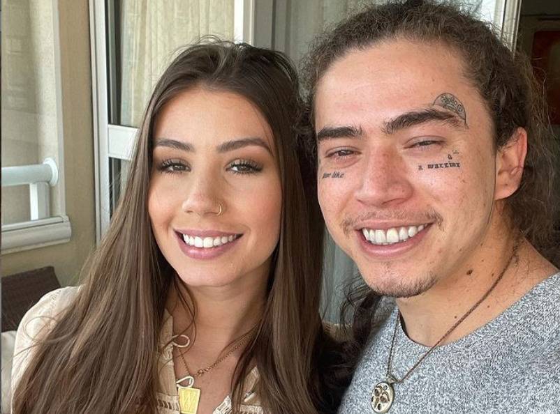 Mulher branca com cabelo castanho e um homem - Metrópoles
