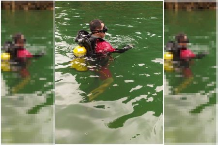 Mergulhador do Corpo de Bombeiros de Minas Gerais em busca de vítimas em Capitólio