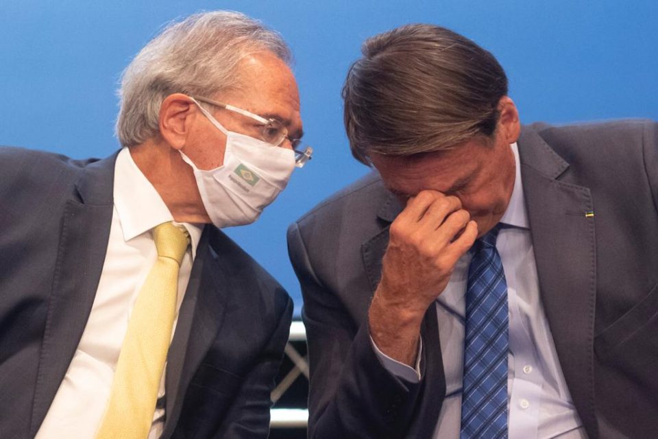Ministro Paulo Guedes e Jair bolsonaro durante cerimônia da Caixa Econômica Federal “Democratizando o Acesso Ao Crédito”