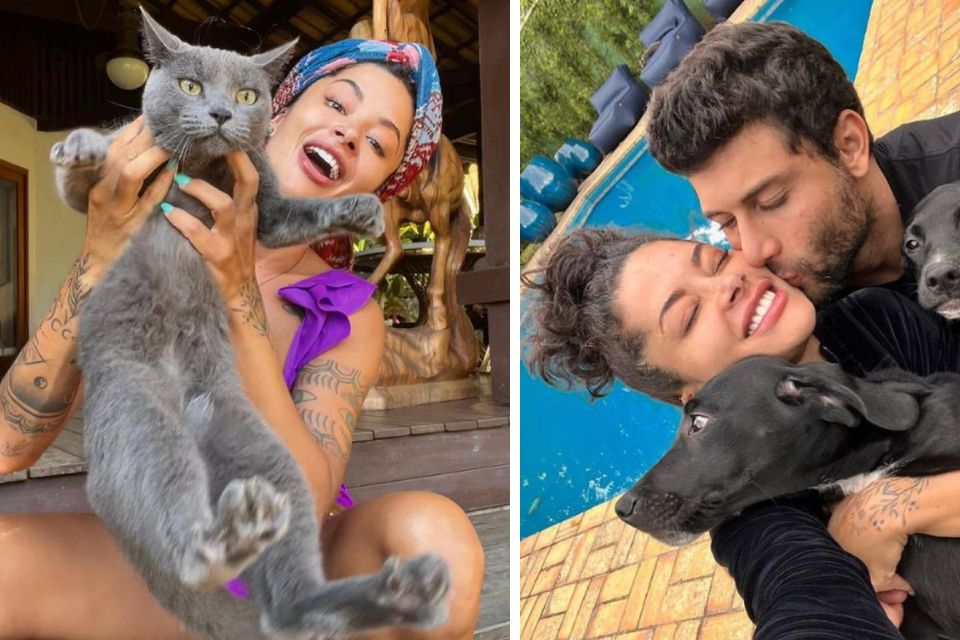 foto colorida de um homem e uma mulher abraçando animais