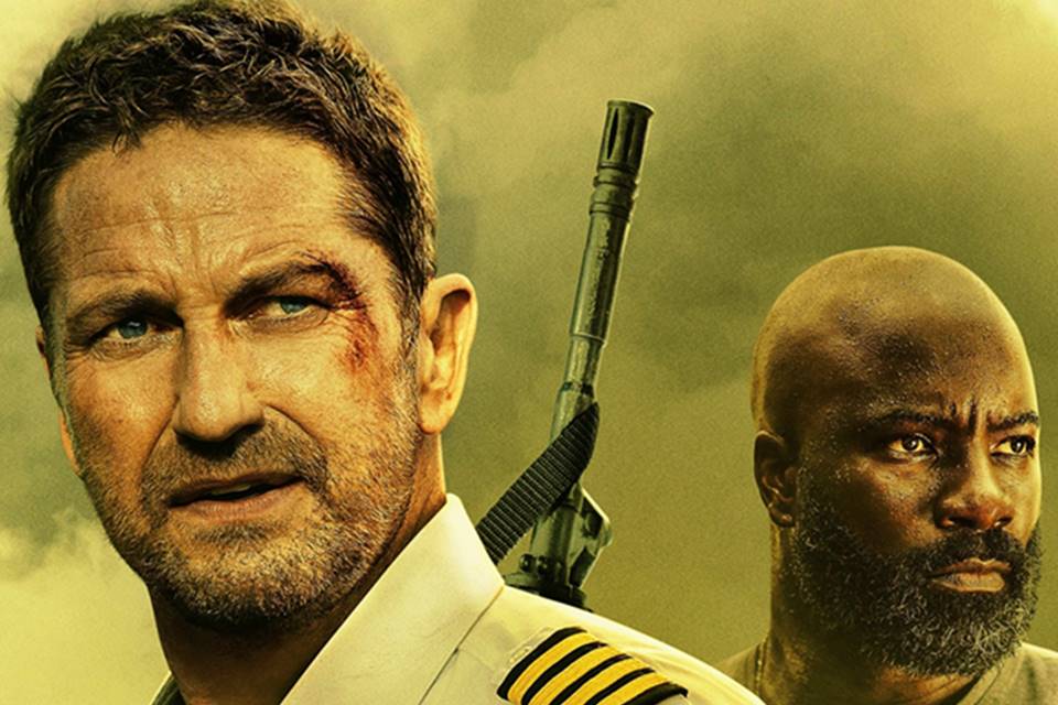 Imagem colorida de Gerard Butler (à esquerda) e Mike Colter (à direita) como personagens do filme Alerta Máximo - Metrópoles