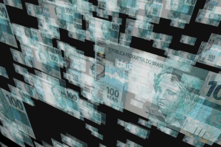 Imagem de notas de real, estilizadas e "ambaçadas", com um fundo preto, ilustrando o Real Digital - Metrópoles