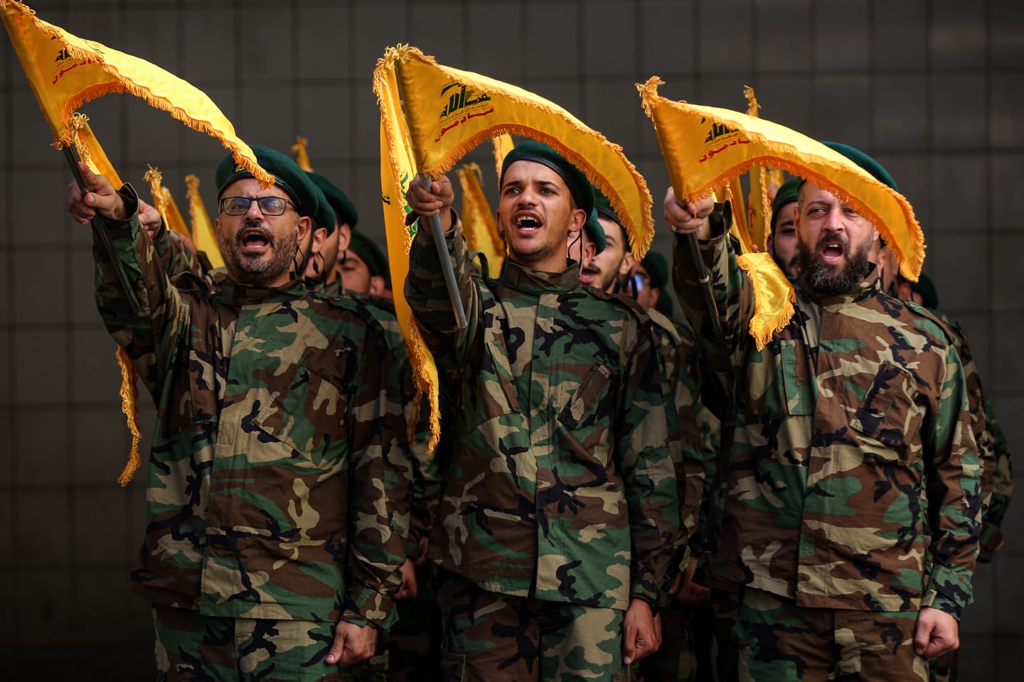 04 November 2023, Lebanon, Beirut: Pro-Iranian Hezbollah militants chant slogans during the funeral procession of their comrade, who was killed in clashes against Israeli forces in south Lebanon. Fifty-eight Hezbollah fighters have been killed since 8 October in south Lebanon following the unprecedented Hamas attack against Israel. Photo: Marwan Naamani/dpa (Photo by Marwan Naamani/picture alliance via Getty Images)