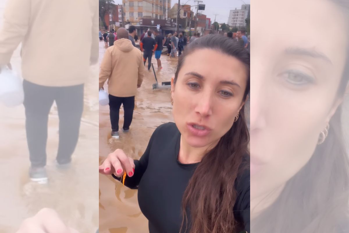 Foto colorida de uma mulher na chuva - Metrópoles