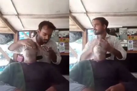 Foto colorida de um homem cuspindo na mão - Metrópoles