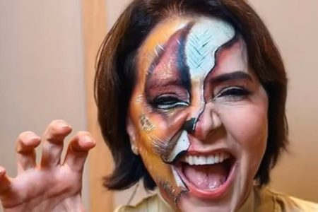 Foto colorida de candidata eleita de Aracaju com maquiagem de leoa - Metrópoles