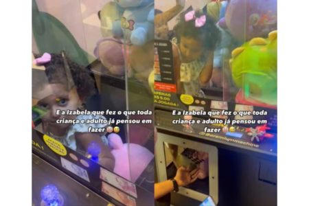 imagem colorida criança presa maquina de pelucias sc